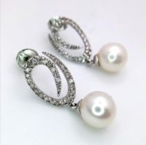 A Pair of 9K White Gold, Diamond and Pearl Earrings. 2.61g total weight. Ref: 15811