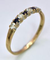 A Vintage 9K Yellow Gold, White and Blue Stone Ring. Size K. 1g total weight.