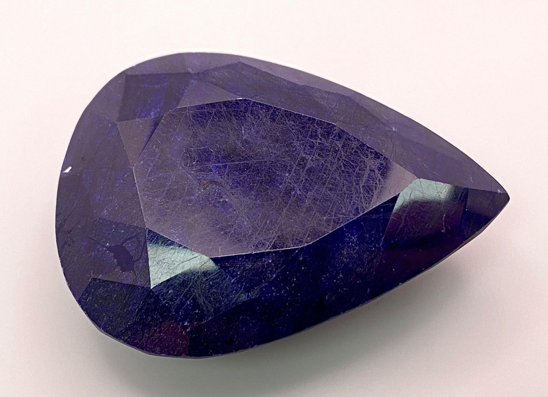 A 473.06ct Large Pear Shape Blue Sapphire Gemstone. Comes with the IGLI Certificate