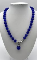 A Mesmerising Dark Blue Cat's Eye Necklace with Drop Pendant. White stone accents. 10mm beads.