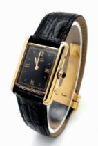 A Cartier, Must de Cartier Vermeil Quartz Ladies Watch. Black leather strap with Cartier buckle.