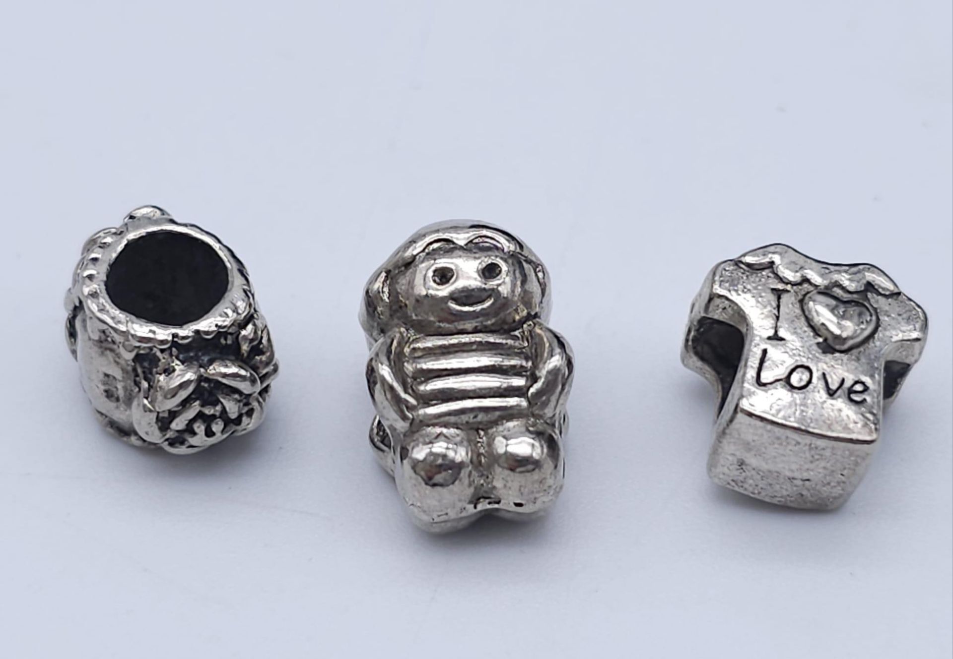 3X STERLING SILVER PANDORA STYLE CHARMS: ROSE, I LOVE T SHIRT & LITTLE BOY. TOTAL WEIGHT 9.6G.