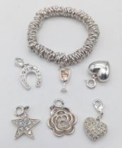 Five Silver Charms and a Silver 'Sweetie' Style Bracelet. 41g total weight.