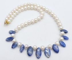 A Cultured Pearl and Rutilated Quartz Necklace with a 9K Gold Clasp. 42cm. 37g total weight.