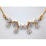 An elegant 18 K yellow gold necklace with with a flower design loaded with diamonds (0.70 carats),