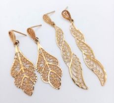 Two elegant and sophisticated pairs of 9 K yellow gold filigree earrings. Drop: 58 and 43 mm