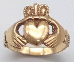 A 9K YELLOW GOLD CLADDAGH RING. TOTAL WEIGHT 3.1G. SIZE 0