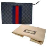 A Gucci GG Supreme Pouch Canvas Bag. Monogram exterior with blue and red stripes. Beige textile