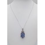 An Unworn Sterling Silver Blue Topaz and Diamond Pendant Necklace. 50cm Length Chain. Pendant