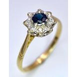 A vintage 18 K yellow gold ring with a blue sapphire surrounded by a halo of diamonds, ring size: P,