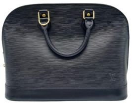 A Louis Vuitton Black Leather Alma Handbag. Textured exterior. Soft textile interior with one open