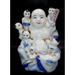 A Vintage or Antique Porcelain Buddha with Oriental Inscription. 12cm Tall.