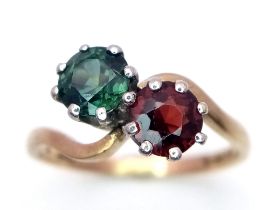 A 9K GOLD CROSSOVER RING WITH 2 GEMSTONES . 2.3gms size M/N