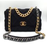 A Chanel 19 Velvet Flap Hand/Shoulder Bag. Quilted velvet exterior with CC lock closure. Signature