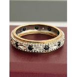 Hallmarked 9 carat WHITE and YELLOW GOLD , DIAMOND and SAPPHIRE ETERNITY RING.2.67 grams. Size P - P
