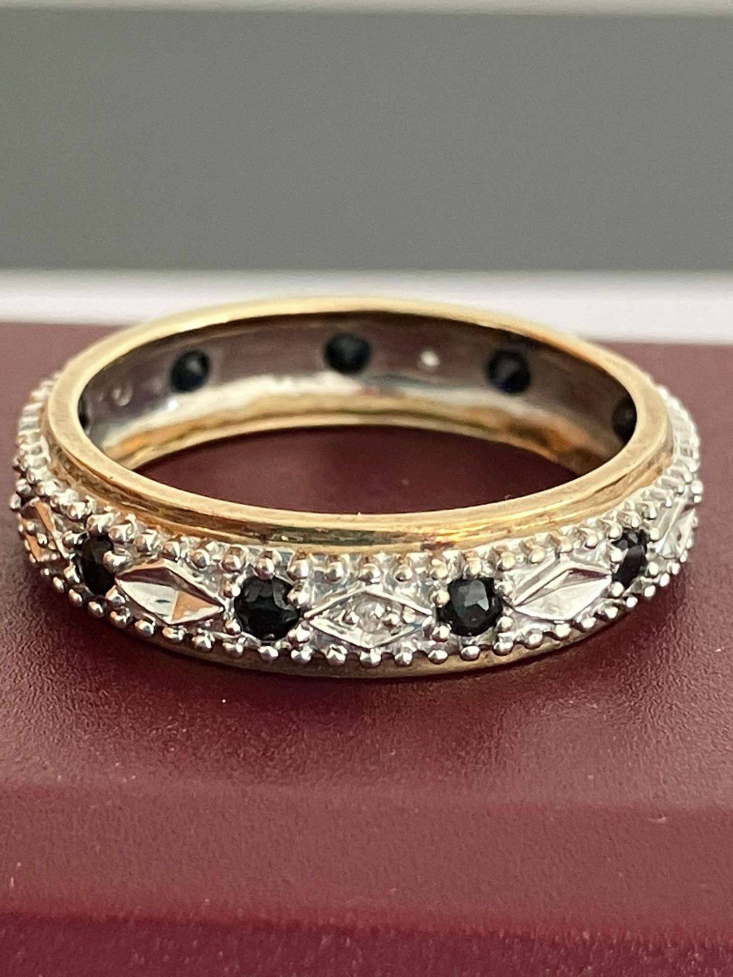 Hallmarked 9 carat WHITE and YELLOW GOLD , DIAMOND and SAPPHIRE ETERNITY RING.2.67 grams. Size P - P