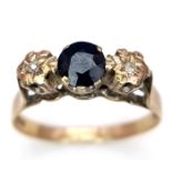 A vintage 9 K yellow gold ring with a round cut sapphire accompanied by two diamonds, ring size: