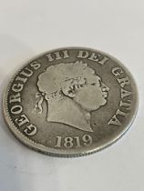 1819 SILVER GEORGE III HALF CROWN. Overall Condition fair.