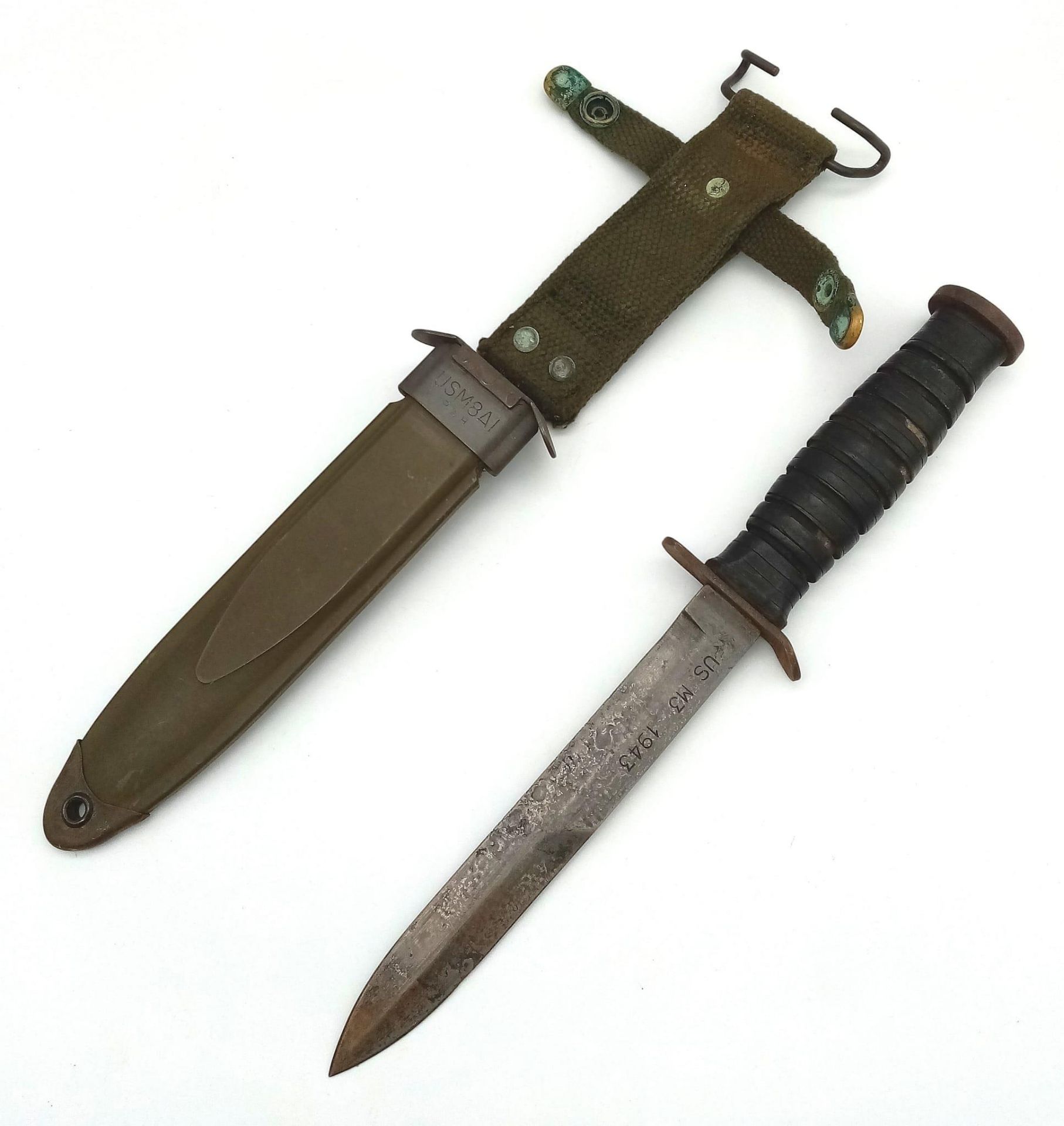 A WW2 US M3 Mk1 Fighting Knife Dated 1943, with M8A1 scabbard. These were issued to the “Shock”