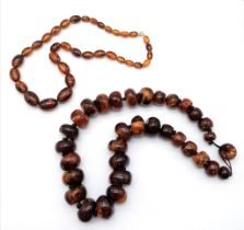 Two Amber Necklaces - Large rondelle beads - 58cm and an oval bead necklace - 58cm.