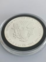 1990 SILVER EAGLE /WALKING LADY SILVER DOLLAR. Brilliant Uncirculated condition. Minted in Pure