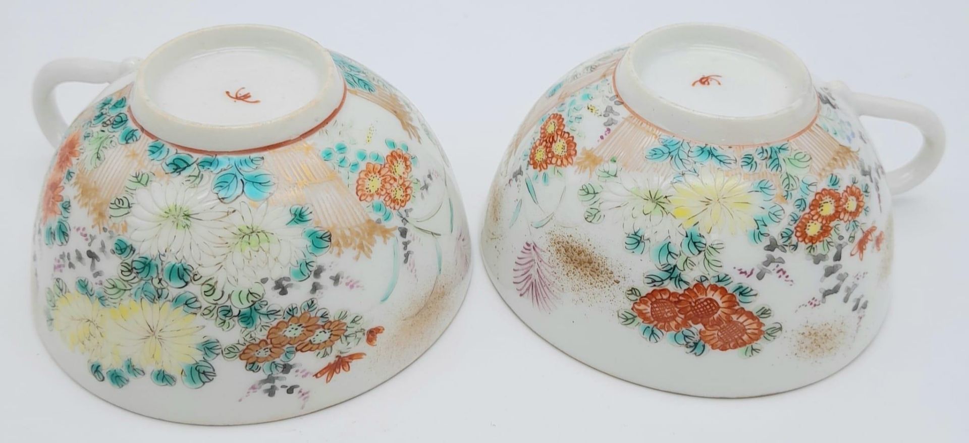 A pair of antique Japanese, hand-painted cup and saucer. Fine bone china with a delightful floral - Image 4 of 9