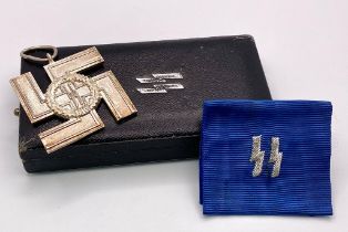 A 3rd Reich Waffen SS 12 Year Service Medal with box and certificate.