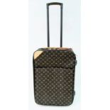 A Louis Vuitton Monogram Canvas Pegase Rolling Suitcase. 37 x 55 x 20cm. Leather accents. Large