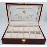 A high-quality ROLEX wooden watch case for 12 watches, made from high gloss cherry veneer and