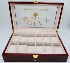 A high-quality ROLEX wooden watch case for 12 watches, made from high gloss cherry veneer and