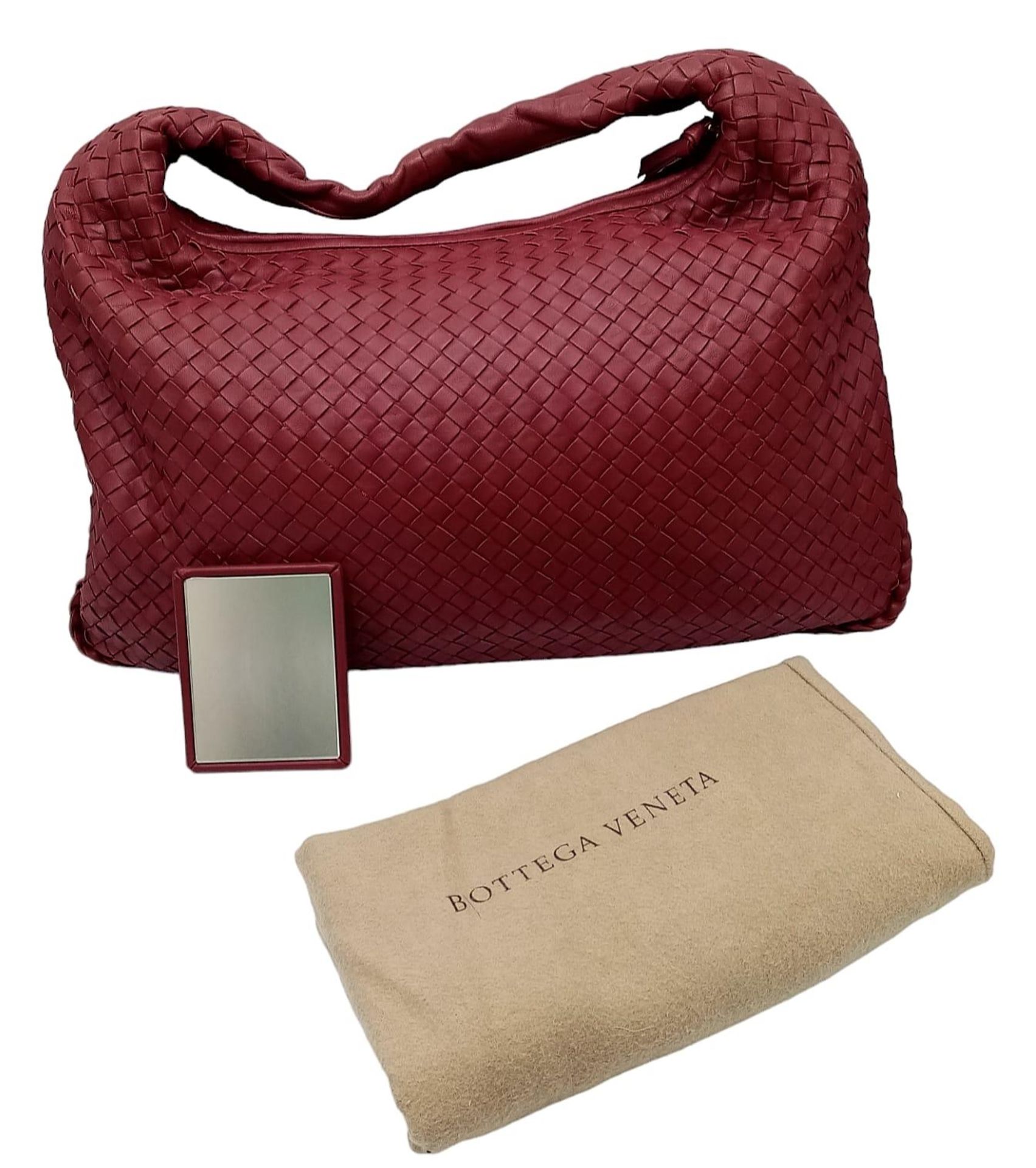 A Bottega Veneta large Hobo bag, soft red nappa leather, beige interior, gold tone top zipper.