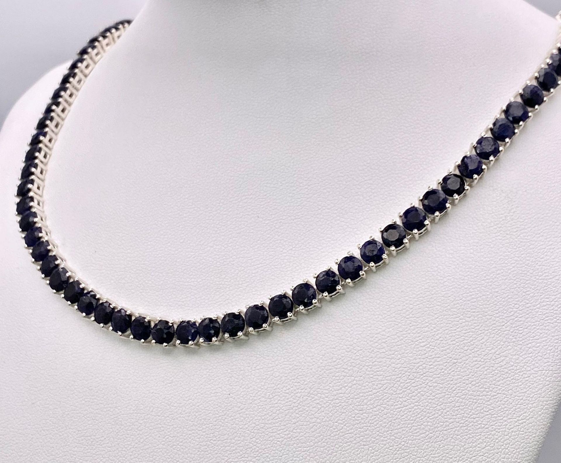 A Blue Sapphire Gemstone Tennis Necklace set in 925 Silver. 45cm length. 40.15g total weight. - Image 2 of 4