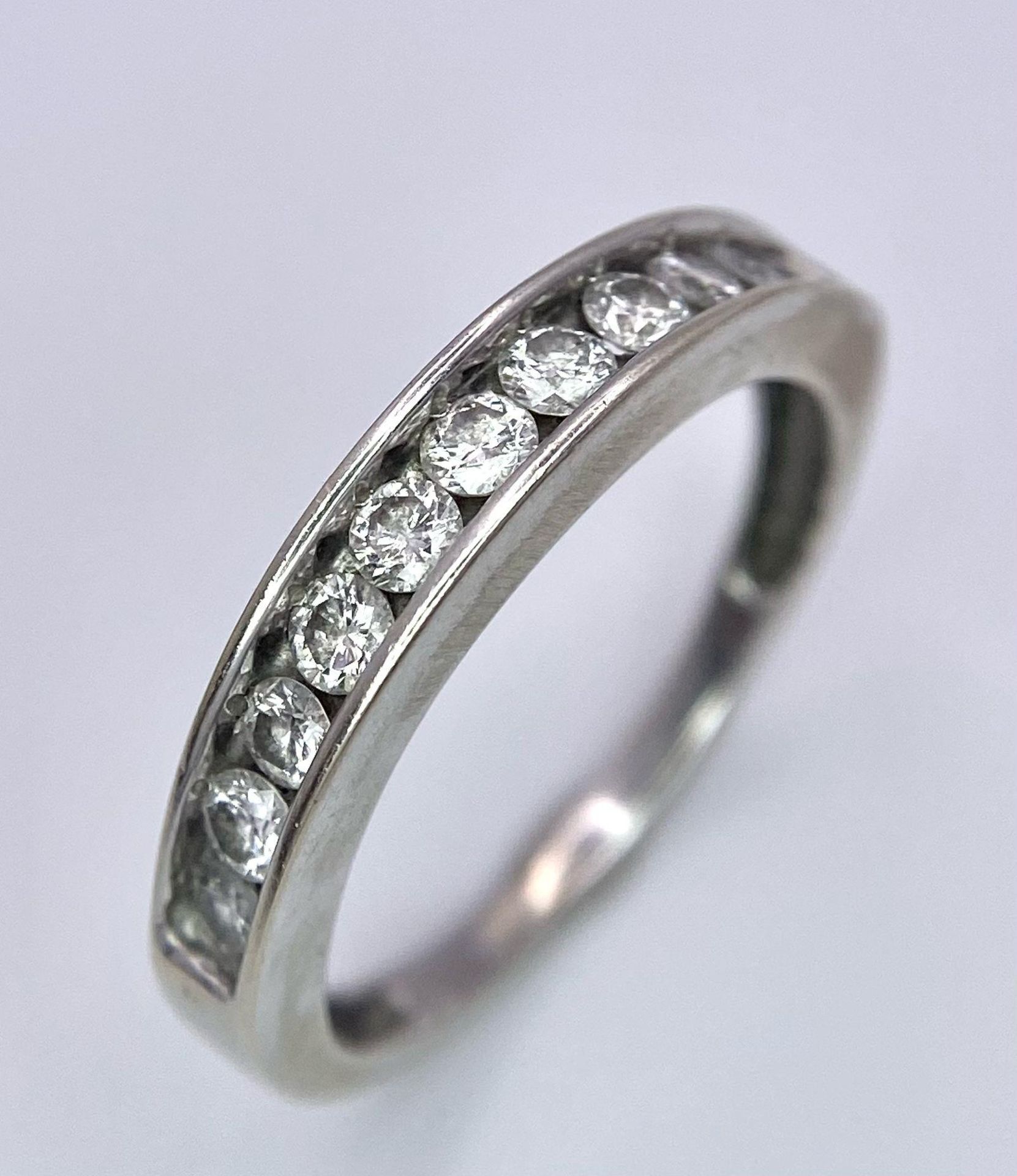 A 14K White Gold, Diamond Half-Eternity Ring. Size N. 2.55g total weight. Ref: 10437