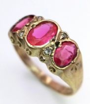 A TRILOGY OF PINK RUBY AND DIAMOND RING SET IN 18K GOLD . 1.7gmas size I/J