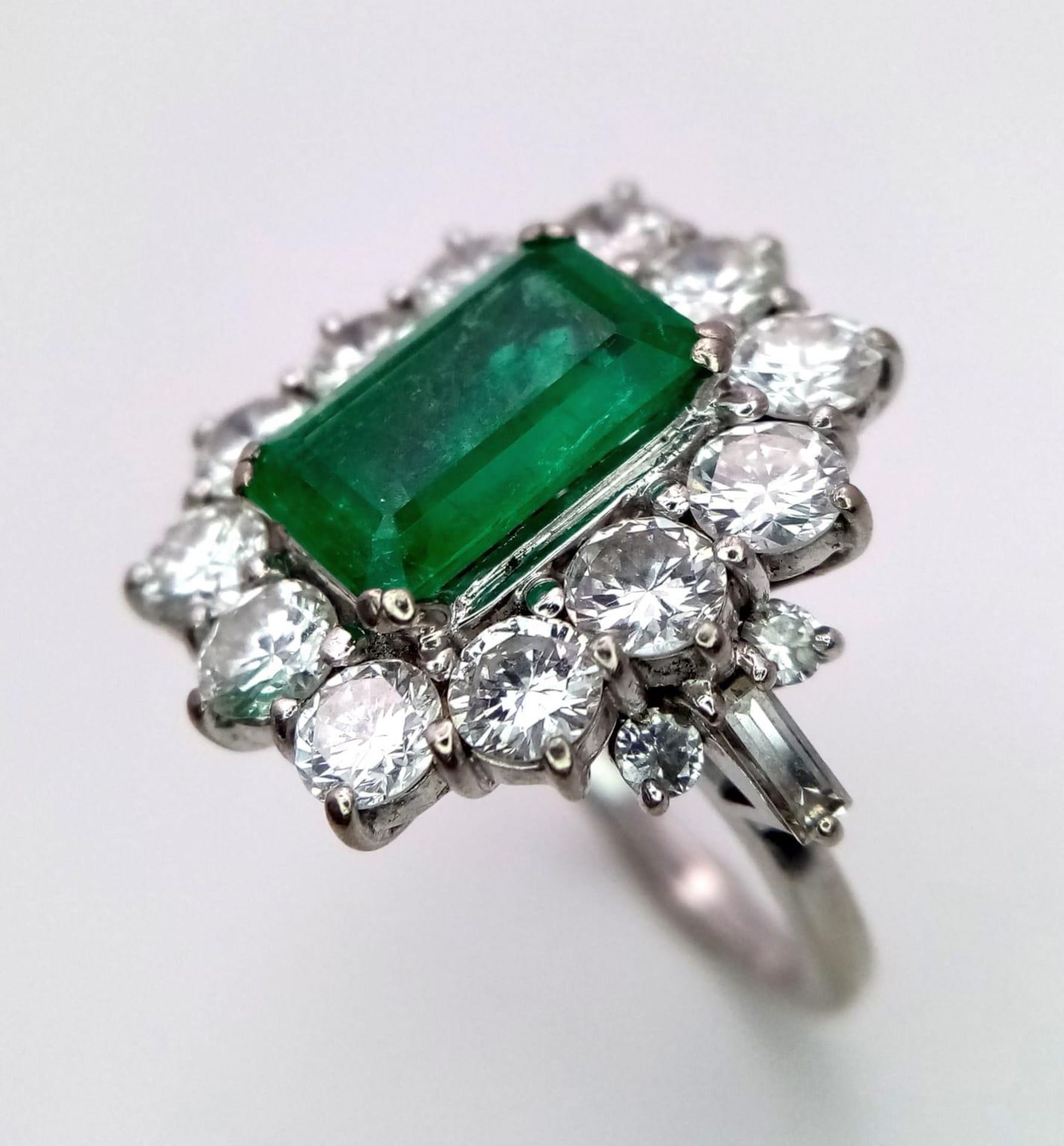 A Head-Turning 18K White Gold, Emerald and Diamond Ladies Dress Ring. Rectangular emerald with a - Image 2 of 7