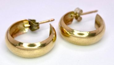 A fancy pair of 9Ct yellow gold hoop earrings. Come with full Birmingham hallmarks. Total weight 1.