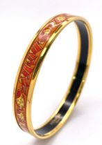 A Hermes Gilded and Enamel Bangle. 6cm inner diameter. Ref: 15686