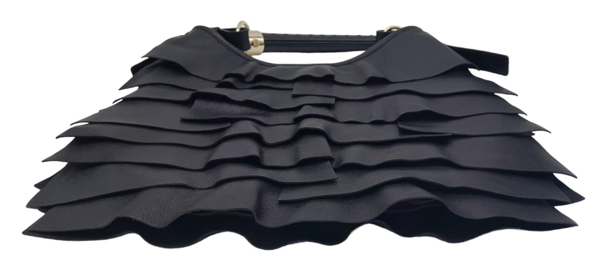 A YSL Saint-Tropez Handbag. Black leather strip exterior. Horn shaped handle. Textile interior - Image 3 of 8