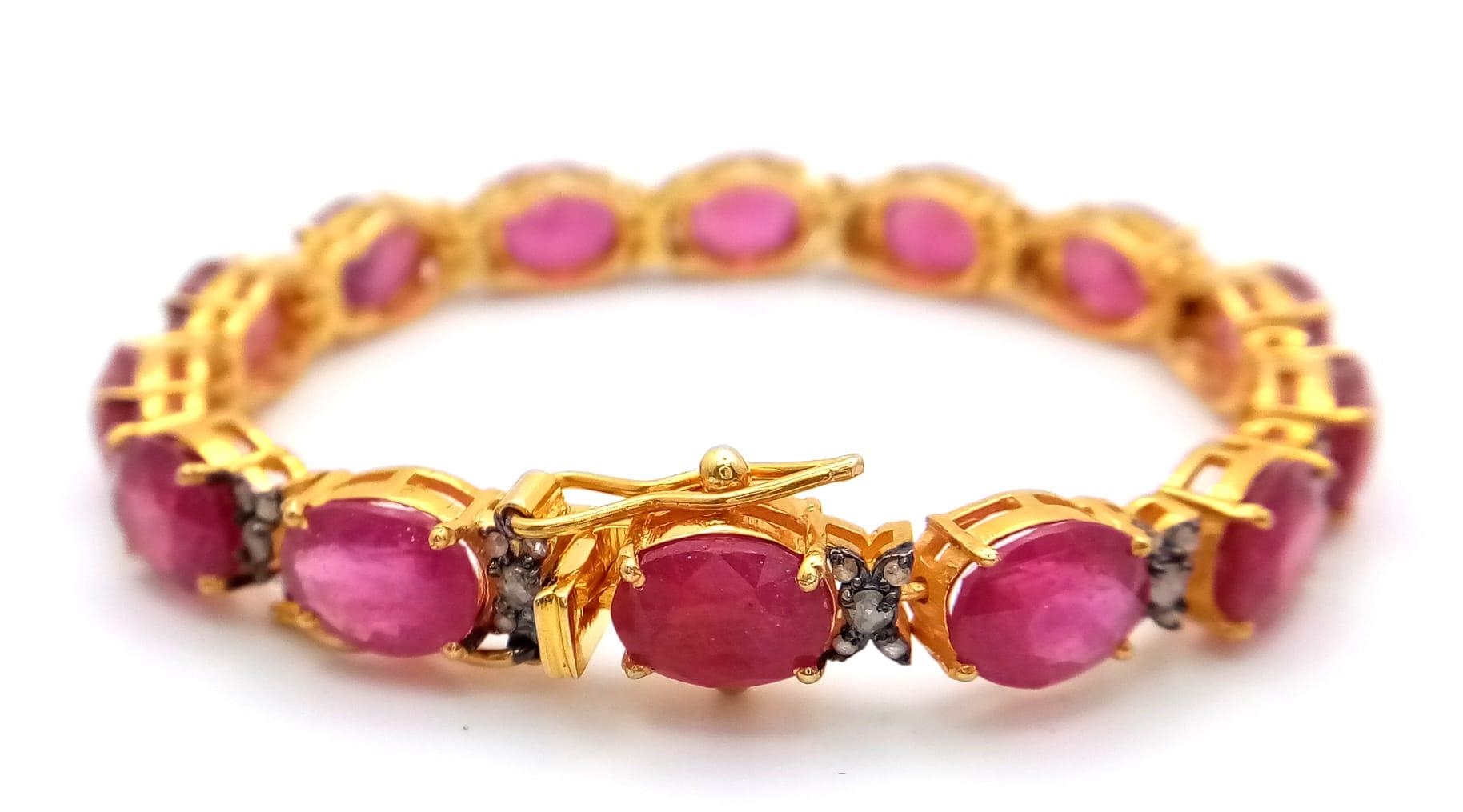An Oval Cut Ruby and Diamond Gemstone Tennis Bracelet set in Gold Plated 925 Silver. 50ctw Rubies - Image 2 of 4