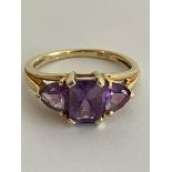 9 carat YELLOW GOLD RING set with AMETHYST GEMSTONES. Mounted in trilogy style, Consisting an (0.