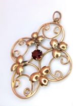 A vintage 9 K yellow gold pendant with a round cut garnet, dimensions: 38 x 28 mm, weight: 1.6 g.