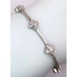 A 14K WHITE GOLD DIAMOND SET IN THE FLORAL DESIGN BRACELET 0.60CT 10.3G 16.5cm length ref: SC 1075