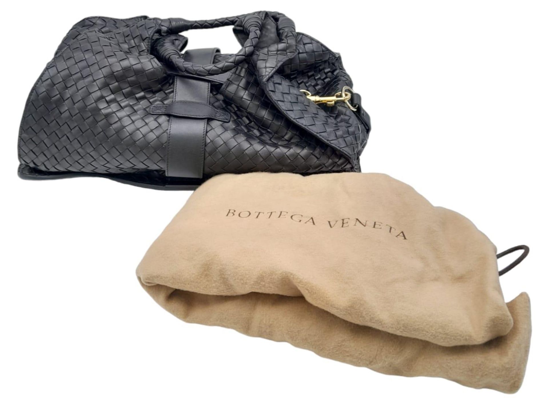 A Bottega Veneta Black Shoulder Bag. Intrecciato leather exterior with gold-toned hardware, two