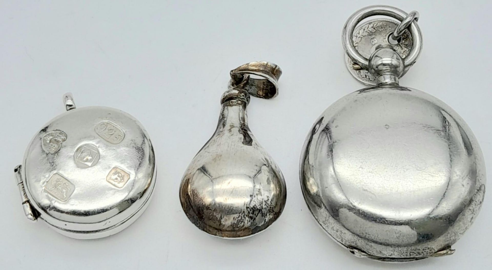 Three Silver Pendant Containers. 4.5cm largest pendant. 40g total weight.