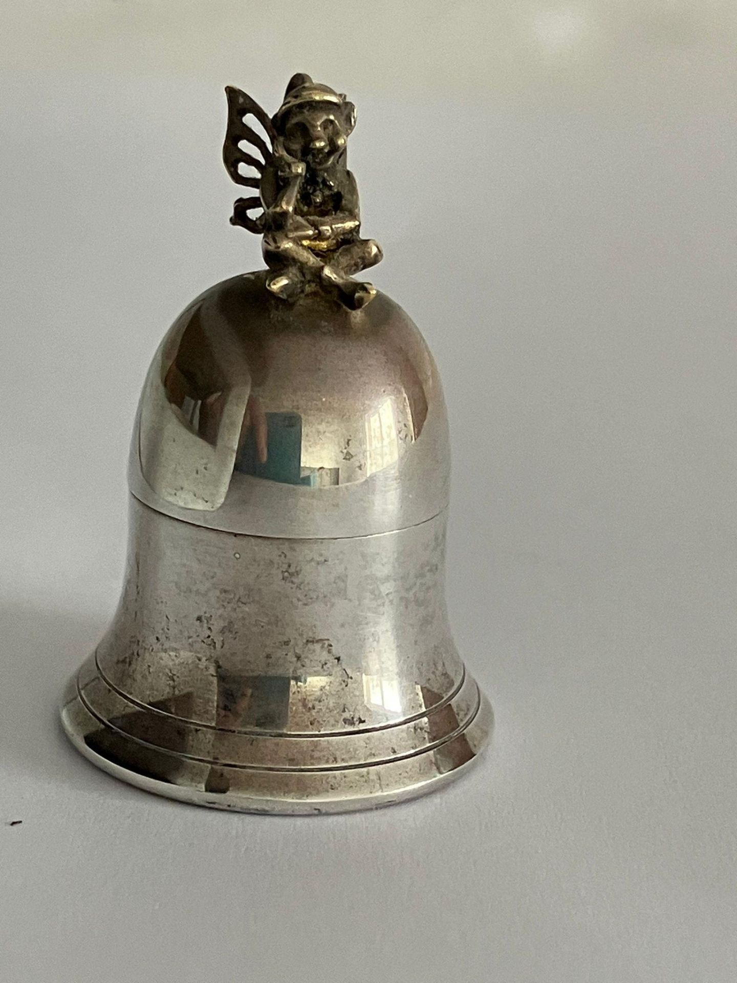 Vintage SILVER PILL BOX IN the form of a BELL with a PIXIE sitting atop. Having Full UK hallmark.