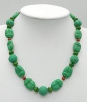 An Antique Chinese Green Turquoise Hand-Carved Necklace. With coral spacers. 35cm. 30.33g