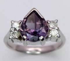 A 9K WHITE GOLD DIAMOND AND CENTRE TEAR SHAPE BLUE STONE SET RING. approx 4.26g SIZE N 1/2. ref: