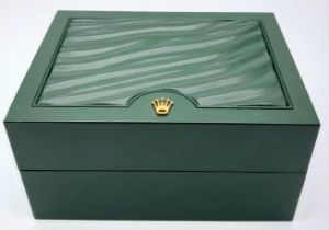 A Rolex Single Watch Box. Exterior green ruffled finish. Soft beige interior. Lightly used but in