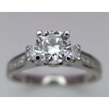 A delightful Sterling Silver, 1ctw Moissanite Ring. Lovely central stone with multiple stones set in