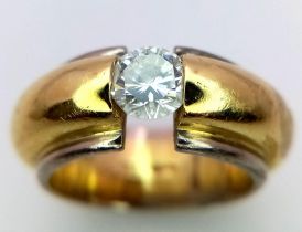 An 18K Yellow and White Gold Diamond Solitaire Ring. 0.584ct brilliant round cut diamond. Comes with